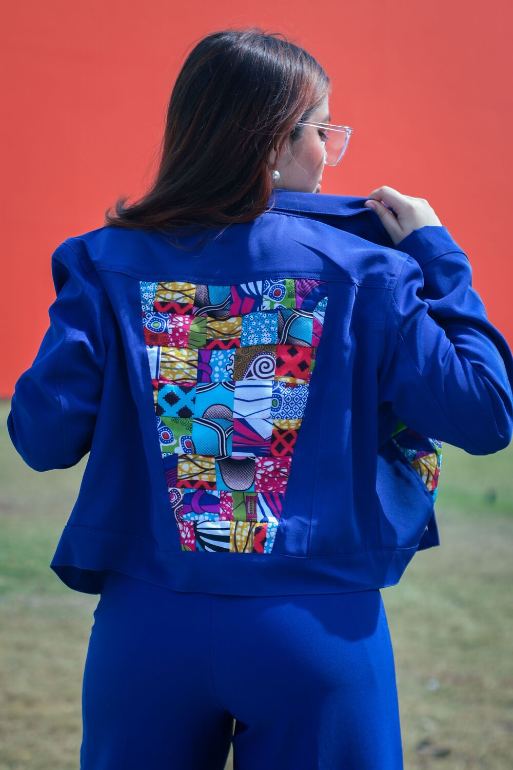 Colorful appliqué adds fashion design texture and dimension to a handmade jacket